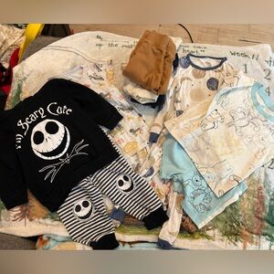 Lot of 12month outfits with Disney outfits and bamboo like pajamas